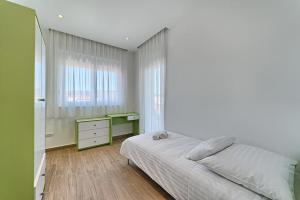 Postel nebo postele na pokoji v ubytování Hotel Trogirski Dvori