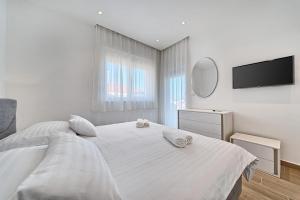 Postel nebo postele na pokoji v ubytování Hotel Trogirski Dvori
