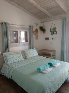 A bed or beds in a room at Oltre le Dune
