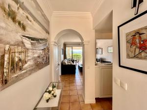 a hallway of a home with a living room at Les Restanques Cabrière 3024 in Grimaud