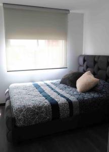 Кровать или кровати в номере 3 Bed apartment, near El Dorado Airport