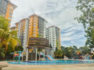 a water park in front of a building at MySuite Studio Apartment Melaka Waterpark Resort in Ayer Keroh