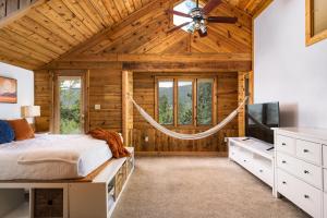 a bedroom with a bed and a ceiling fan at Evergreen Castle - SLEEPS 8 - Close to skiing in Evergreen