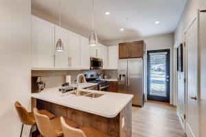 a kitchen with white cabinets and a white counter top at The Honeysuckle Homestead Georgetown Living in Georgetown