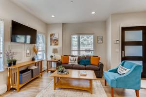 a living room with a couch and a table at Lake View Lodge Gateway To The Rockies Sleep 6 in Georgetown