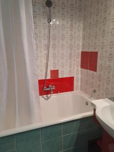 a bathroom with a bath tub and a sink at Accommodation Zara in Vukovar +39 photos