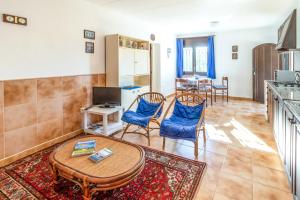 TV a/nebo společenská místnost v ubytování Grifeu 10 Apartamento con terraza