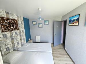 Ένα ή περισσότερα κρεβάτια σε δωμάτιο στο Appartement 2 personnes les Sables-d'Olonne