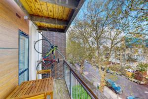 a balcony with a bike on the side of a building at 2Bed Flat w Lift & Balcony -10min to Tube Station in London