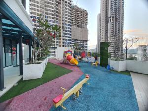 a playground in a building with buildings at Reizz Homestay By Classy in Kuala Lumpur