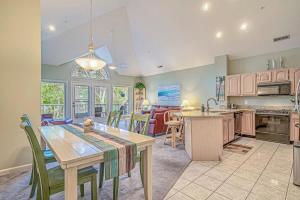 a kitchen and living room with a table and chairs at Tidewater Golf Community 722 Teal Lake in North Myrtle Beach