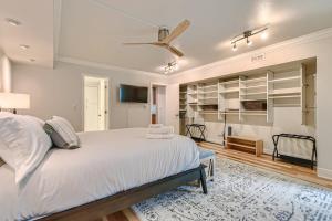 a white bedroom with a bed and a ceiling fan at Larimer Luxury Top Notch Amenities Walk to All in Denver +34 photos