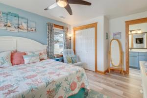 a bedroom with a bed and a ceiling fan at Coastal Home with Deck, Outdoor Shower Walk to Beach in Kill Devil Hills