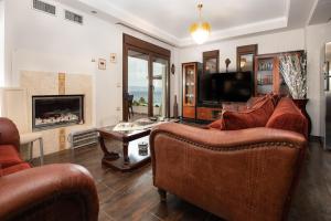 TV a/nebo společenská místnost v ubytování Villa Maria Luxury