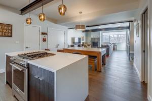 a kitchen with a stove and a counter top at Roof Top Deck w Views Walk to Empower Field in Denver