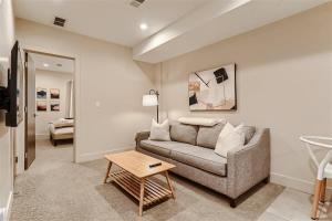 a living room with a couch and a table at Serenity at Sloan's 1-BR with a Modern Twist in Denver