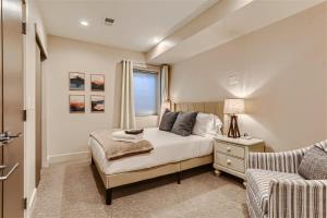 a bedroom with a bed and a couch at Serenity at Sloan's 1-BR with a Modern Twist in Denver