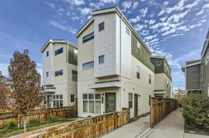 an apartment building with a wooden fence at Serenity at Sloan's 1-BR with a Modern Twist in Denver