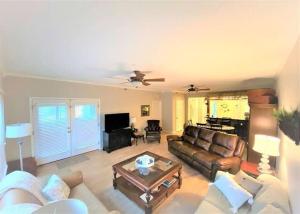 a living room with a couch and a table at Teal Lake 212 in North Myrtle Beach