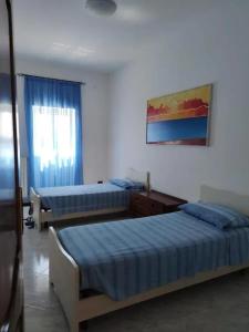 Postel nebo postele na pokoji v ubytování 3 bedrooms apartement with garden and wifi at Fasano 8 km away from the beach