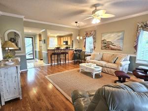 a living room with a couch and a table at Teal Lake 1413 in North Myrtle Beach