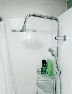 a bathroom with a shower with a sink and a shower at Hostel Central Skopje in Skopje +59 photos