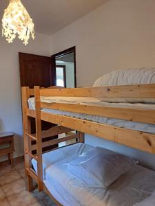a bedroom with two bunk beds and a mirror at Villa Provençale à Mougins in Mougins