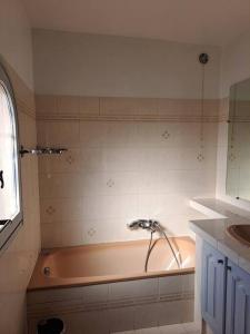 a bathroom with a bath tub and a sink at Villa Provençale à Mougins in Mougins +12 photos