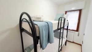a pair of bunk beds in a room at Hellen House by Ca-Sa Check in Chioggia