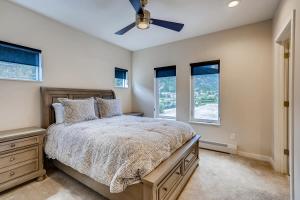 a bedroom with a bed and a ceiling fan at Rambler's Retreat Sleeps 8 Lakefront View in Georgetown