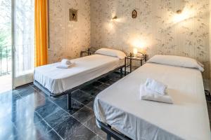 Postel nebo postele na pokoji v ubytování Grifeu 14 Apartamento con terraza y jardín