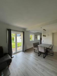 a living room with a table and a couch at Apartment Ida in Viereth-Trunstadt