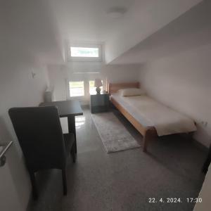 Ліжко або ліжка в номері Apartman Numero Uno