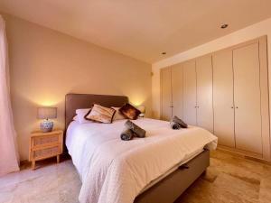 a bedroom with a large bed and a night stand at Modern 2 Bedroom Beachside Apartment NR72 in Los Alcázares +13 photos