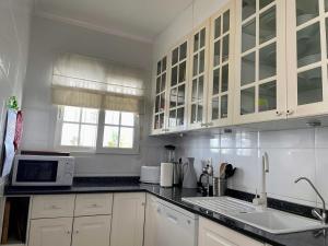 A kitchen or kitchenette at Lovely 3 Bedroom Villa with Com Pool LD502