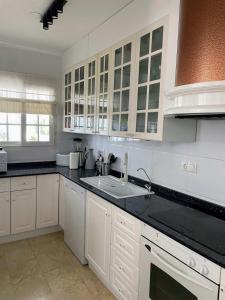 A kitchen or kitchenette at Lovely 3 Bedroom Villa with Com Pool LD502
