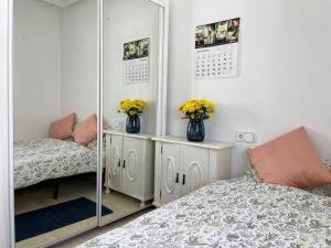 A bed or beds in a room at Lovely 3 Bedroom Villa with Com Pool LD502