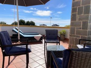 A balcony or terrace at Lovely 3 Bedroom Villa with Com Pool LD502