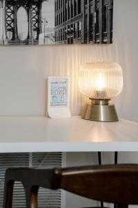 a lamp sitting on a desk next to a coffee cup at #StayInMyDistrict Piedmont Near Parks and Shopping in Portland +29 photos