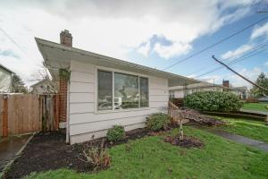 a small white house with a yard at #StayInMyDistrict Piedmont Near Parks and Shopping in Portland