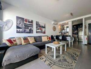 a living room with a couch and a table at Modern 2 Bed Apt in La Zenia LZ9 in Orihuela