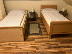 Una cama o camas en una habitación de Appartement Ferienwohnung LANG