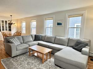 a living room with a couch and a table at Large 3BR Home in Downtown Bar Harbor! [Eden West] in Bar Harbor +38 photos