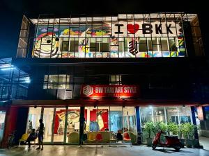 a building with a sign on the side of it at BW Thai Art Style Hotel in Bangkok