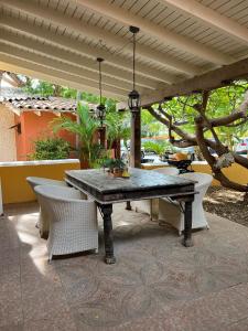 a table and chairs on a patio at Sun Reef Village on Sea in Willemstad