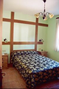 Кровать или кровати в номере APARTAMENTOS Y HABITACIONES RURALES "El Corral"