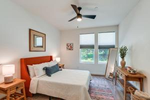 a bedroom with a bed and a ceiling fan at Pet-Friendly Nashville Townhouse with Private Deck! in Nashville