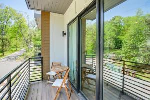 a balcony with sliding glass doors and a table and chairs at Pet-Friendly Nashville Townhouse with Private Deck! in Nashville