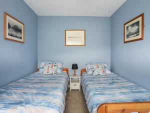 Ένα ή περισσότερα κρεβάτια σε δωμάτιο στο Waters Edge Ymyl Y Dwr