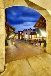 a view of an empty street at night at Hotel Belle Epoque in Beaune